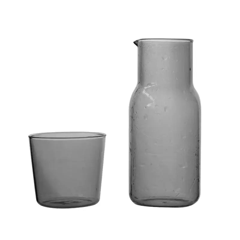 Matte gray glass 550ml bedside water carafe with slender neck and subtle texture paired with matching tumbler