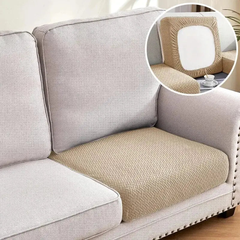 Beige herringbone-patterned couch cover with elastic edges for sectional sofa in living room use