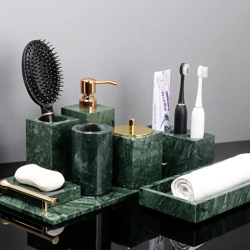 Green marble bathroom set with gold accents featuring marble accessories for elegant bathroom decor
