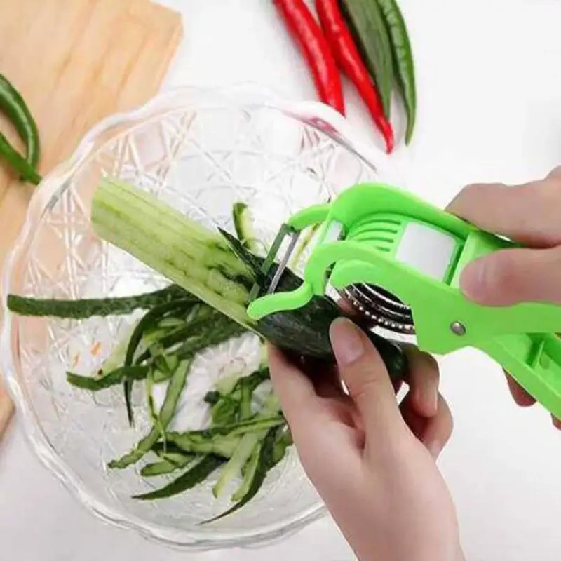 Green plastic 2-in-1 peeler slicer with ergonomic handle and retractable blade peeling a cucumber in kitchen use