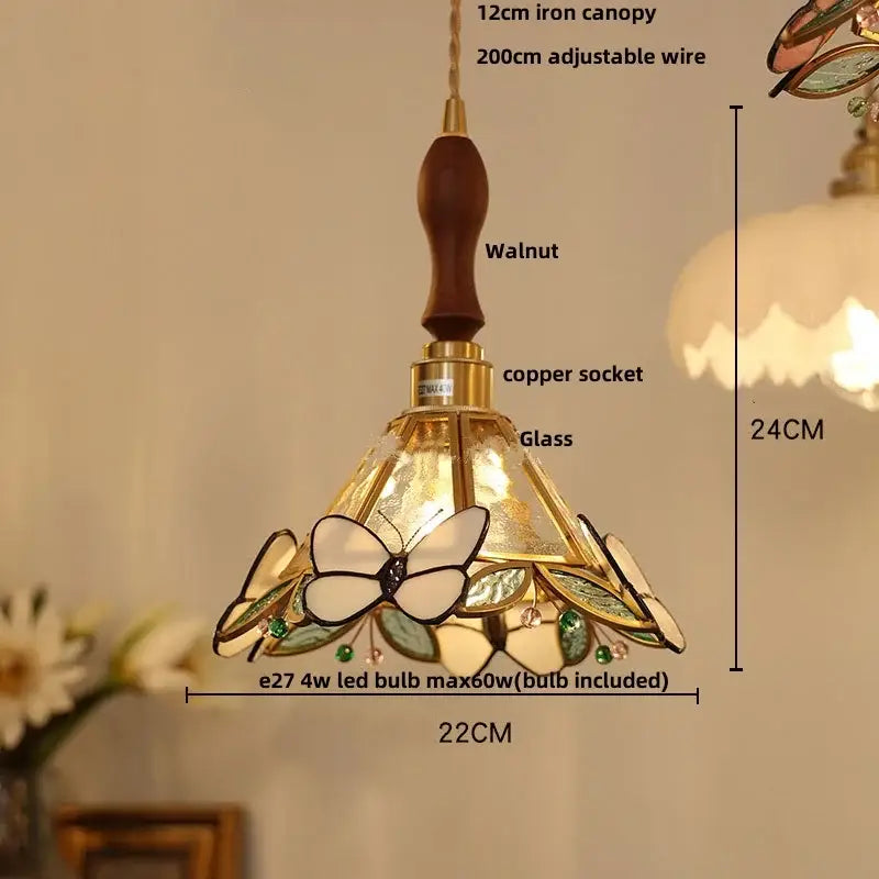 Green stained glass butterfly pendant light with brass accents featuring clear glass led decorbites design for bedroom