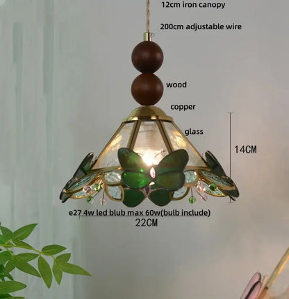 Green stained glass butterfly pendant light with clear glass led shade and brass accents for bedroom decorbites style