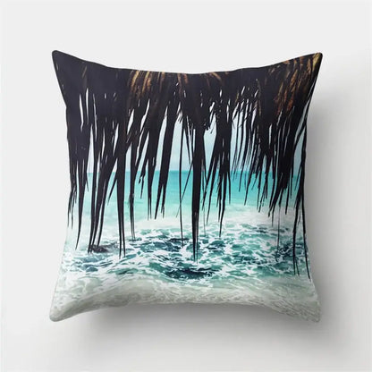 Square throw pillow with decorbites green tropical leaves featuring dark palm fronds and turquoise ocean waves decor