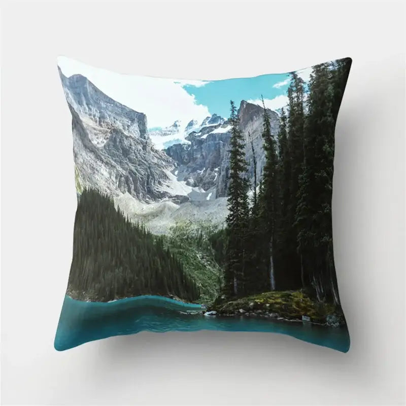 Square throw pillow with vivid snow-capped mountains and turquoise lake waters in decorbites green tropical leaves forest design
