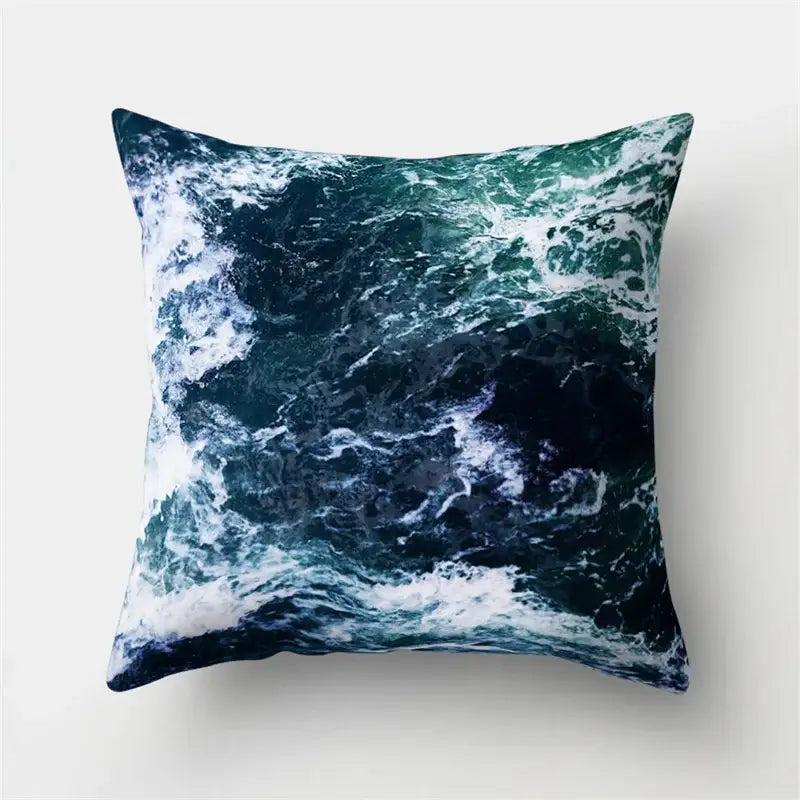 Square throw pillow with crashing ocean waves print in deep teal and navy blue for decorbites green tropical leaves decor