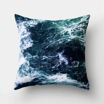 Square throw pillow with crashing ocean waves print in deep teal and navy blue for decorbites green tropical leaves decor