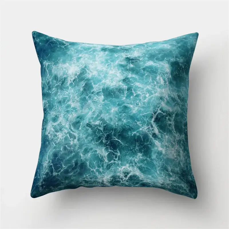 Square throw pillow with dynamic teal ocean wave pattern and white foam accents for decorbites green tropical leaves decor