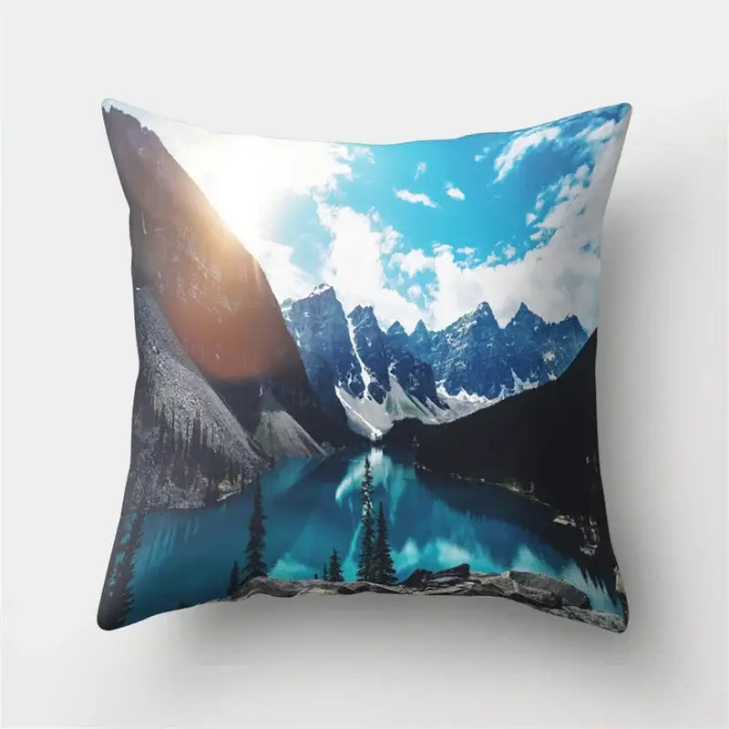 Square throw pillow with vivid lake louise print featuring snow-capped mountains and pine trees for green tropical leaves decorbites