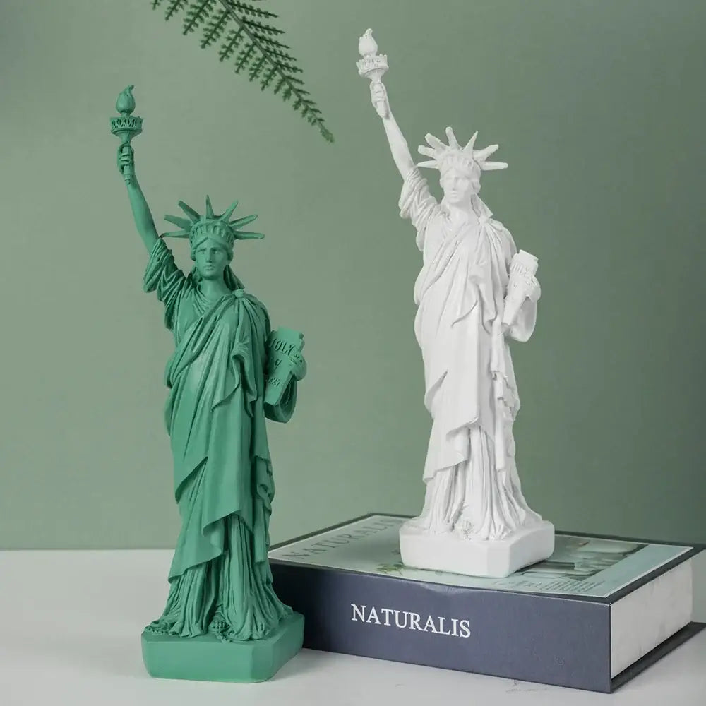 Two resin liberty statue models in vibrant green and white detail designed as decorbites liberty statue office desk decor