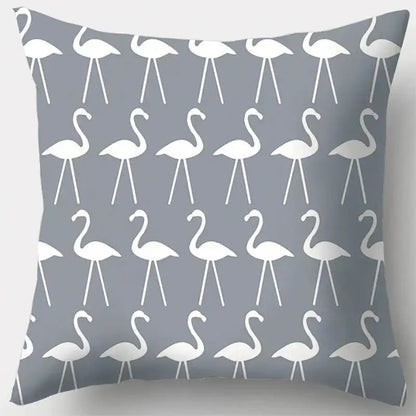 Grey throw pillow case with white flamingo silhouettes featuring grey geometry pattern for living room decor