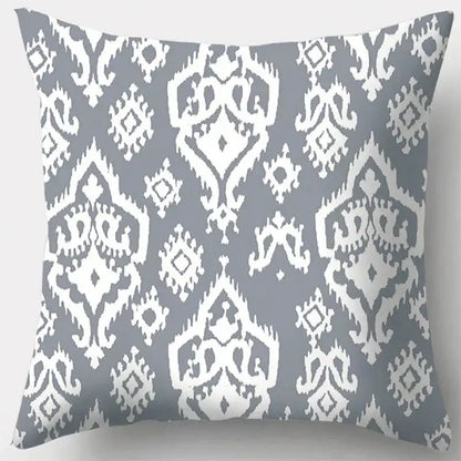 Gray and white ikat-patterned pillow case featuring grey geometry leaves design for living room decor