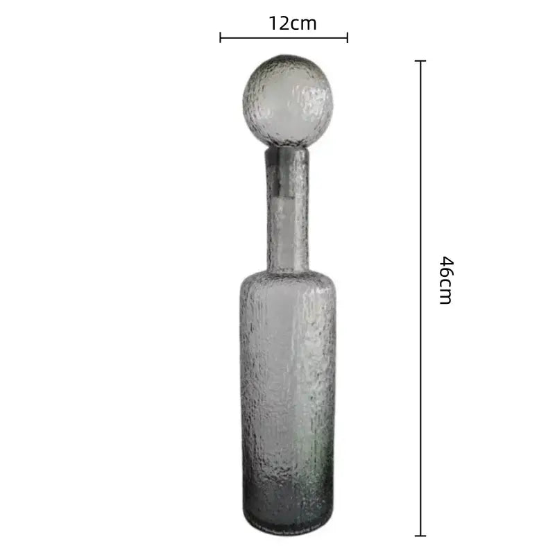 A tall grey round glass decanter with textured hammer lid stopper, 12cm wide by 46cm high for living room decorbites decor