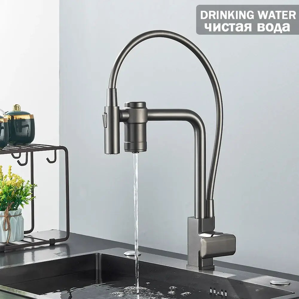 Modern matte black kitchen faucet with curved spout and pull-down spray head for filtered water in gun grey finish