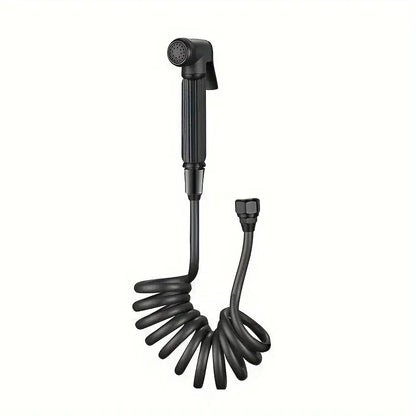 Black coiled handheld shower nozzle with textured grip and threaded connection in gunmetal gray copper bidet parts set