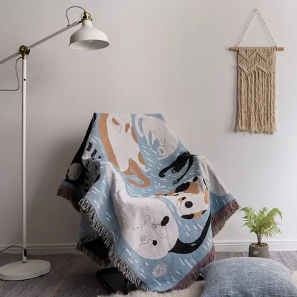 A cozy light blue halloween style tassel throw blanket with playful panda pattern and soft fringed edges for bedroom decor