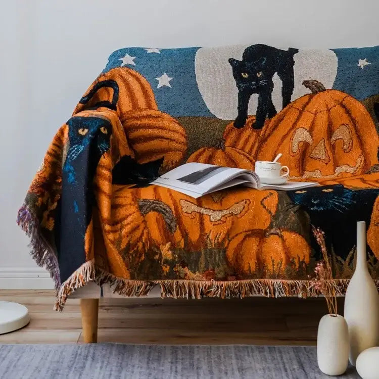 Orange and black halloween style tassel throw blanket with pumpkins cats and moon design for bedroom decor