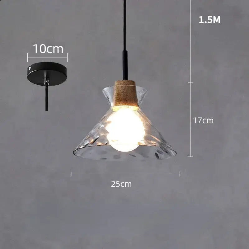 Hammered clear glass pendant light with textured decorbites clear glass, natural cork wood accent, and black metal hardware