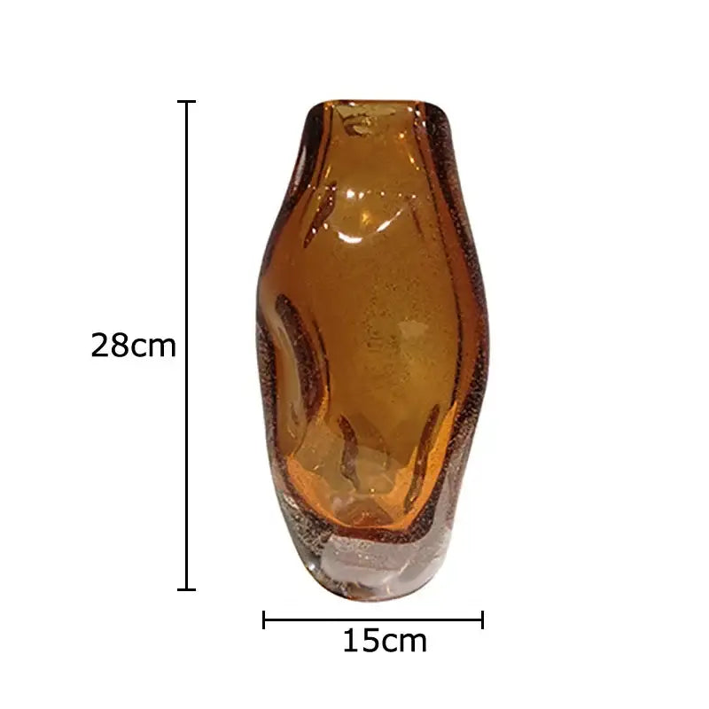 A tall hand blown amber glass vase with a smooth curved body and textured base for decorbites amber glass decor