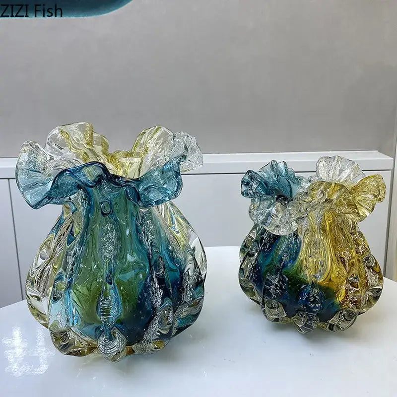 Two hand blown glass vases with colorful flower edge rims in blue green and yellow for dining room decor