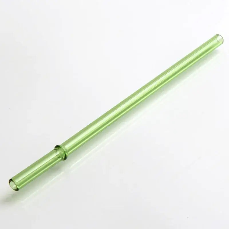 A translucent light green hand blown glass straw with a smooth shape from decorbites glass straws set