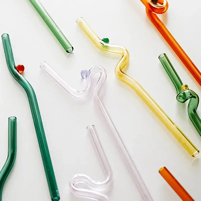 Hand blown colorful twisted glass straws set featuring transparent curved designs for stylish drinkware by decorbites glass