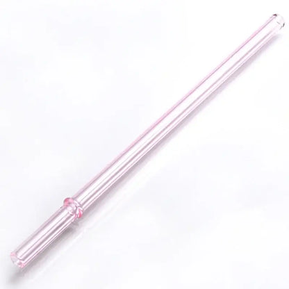 A translucent pink hand blown glass straw with a decorative floral design from decorbites glass straws set