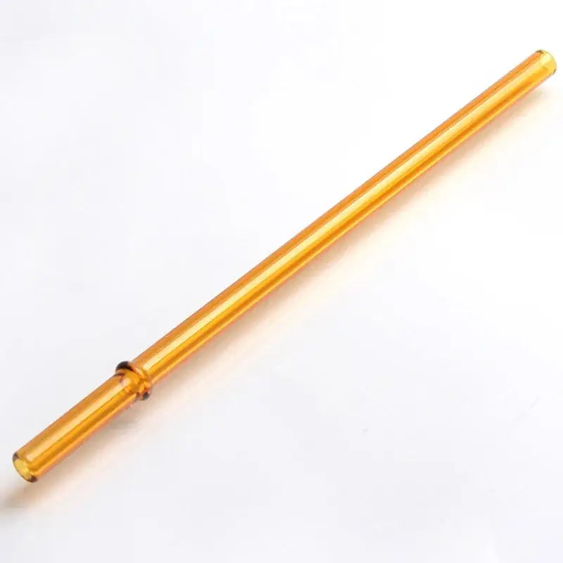 Golden translucent hand blown glass straw with smooth cylindrical design and slight bend from decorbites glass straws set