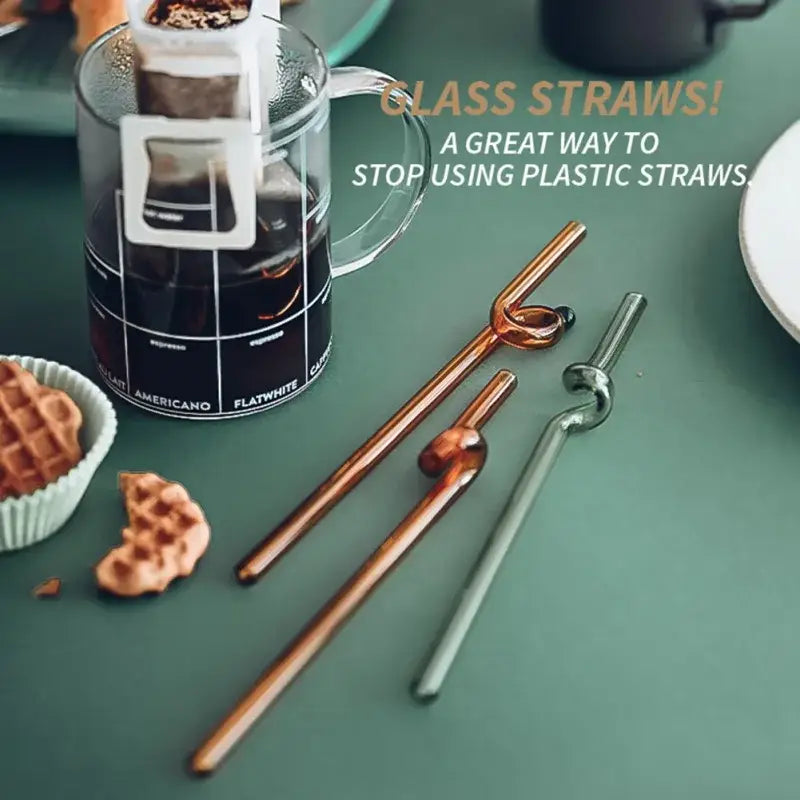 Set of three hand blown decorbites glass straws with colorful twisted knotted design in copper and green finishes