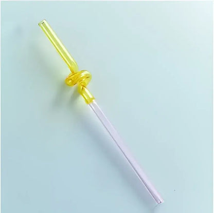 Yellow hand blown glass straw with a clear knot design from decorbites glass straws kitchen drinkware set