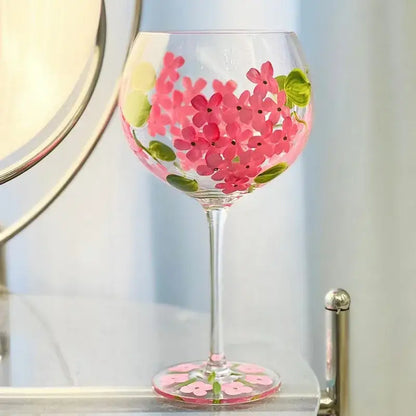 Hand-painted floral wine goblet with vibrant pink flowers and green leaves on clear crystal glass by decorbites crystal