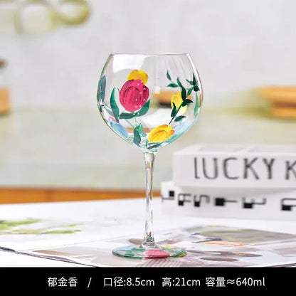 Hand-painted floral wine goblet with vibrant pink and yellow tulips on clear decorbites crystal glass