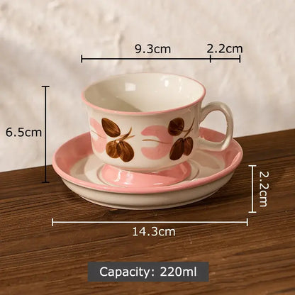 A delicate pink and white hand-painted flowers pattern ceramic cup and saucer set with decorbites flowers pattern