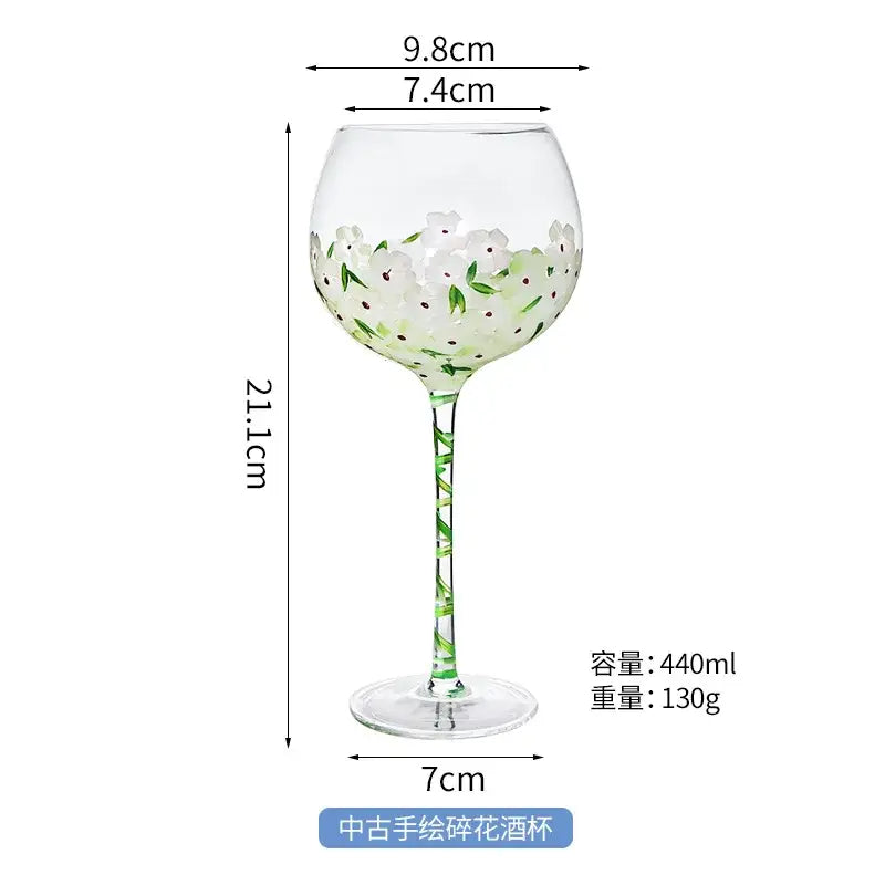 Hand painted glass goblet with white and green floral design pink and yellow decor 21.1cm height 440ml capacity