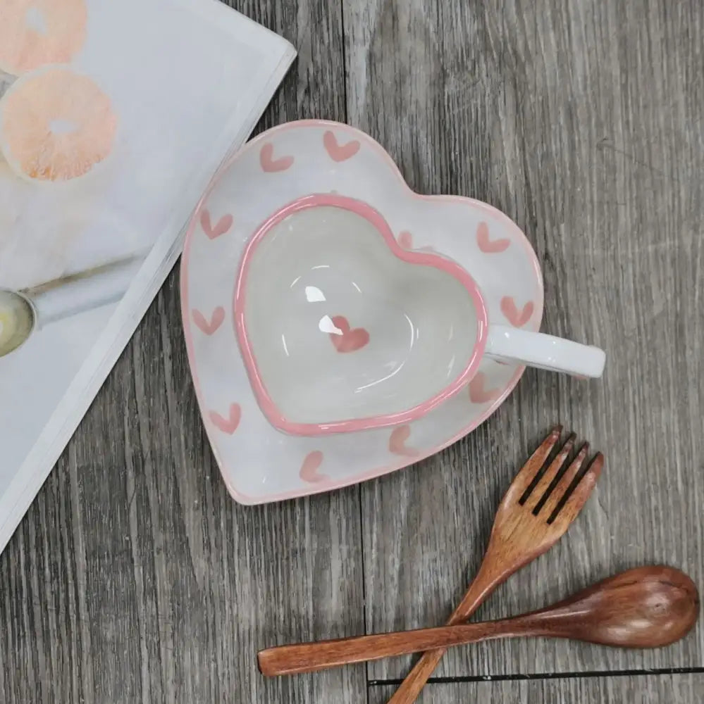 White ceramic love mug with hand painted heart handle pink rim and small pink hearts on saucer set