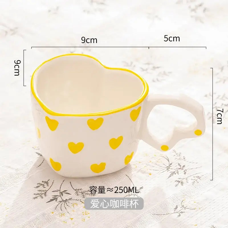 White ceramic love mug with hand painted heart handle yellow heart patterns and matching yellow rim kitchen set