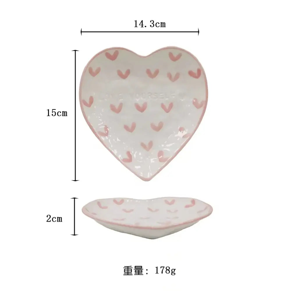 A white ceramic hand painted heart saucer with pink hearts and delicate pink rim for love mug kitchen set