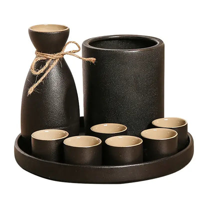 Handcrafted black ceramic wine warmer sake set with matte finish featuring bottle tied with twine and six cups on tray decorbites black ceramic