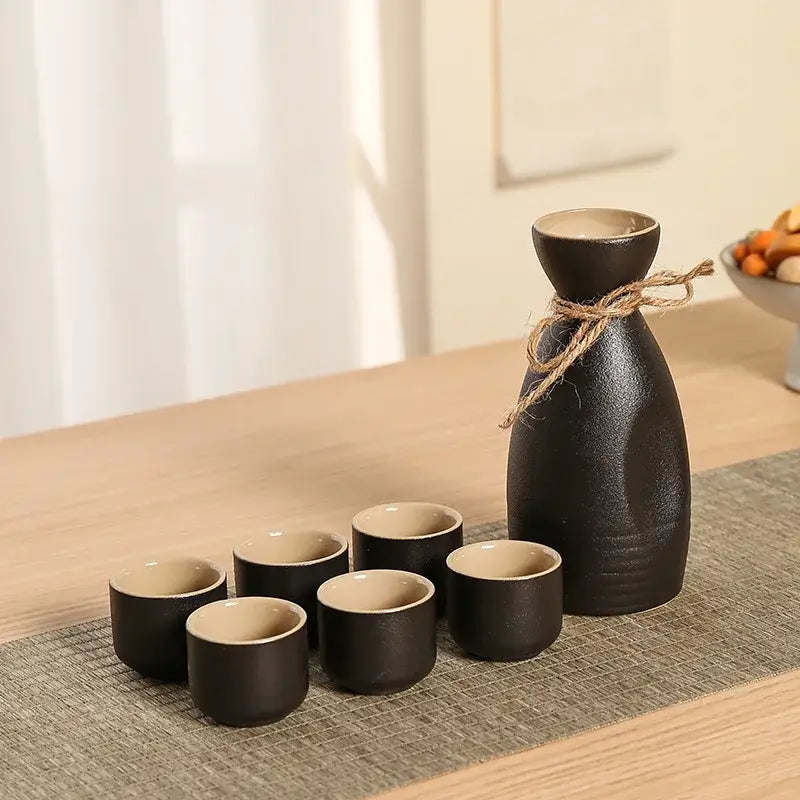 Handcrafted black ceramic wine warmer sake set with six cups and textured bottle tied with twine by decorbites black ceramic