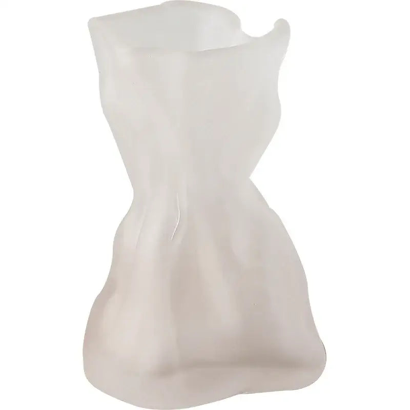 A translucent white plastic vase shaped like a stylized dress with folded road decorbites clear glass design