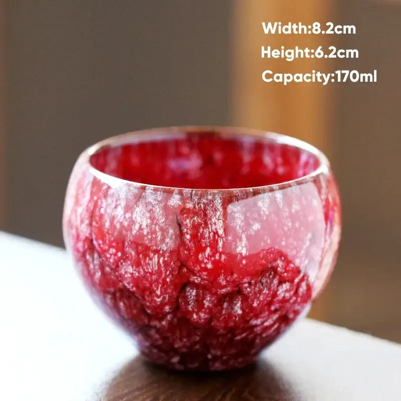 Vibrant red handcrafted ceramic coffee cup with a textured crackle glaze finish for dining room drinkware