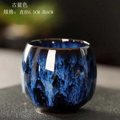 Glossy deep blue ceramic kung fu tea cup set with swirling textured crackle glaze and slightly flared rim for decorbites