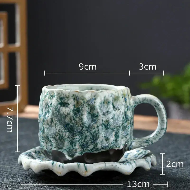 Handcrafted green and white speckled hammer pattern porcelain mugs with textured glaze and matching scalloped saucers set of 2