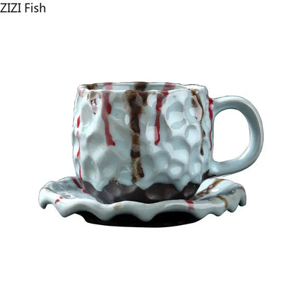 Handcrafted white hammer pattern porcelain mug with textured finish and red brown glaze on matching scalloped saucer