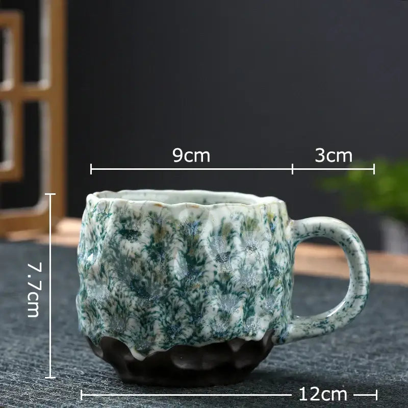 Handcrafted earthy hammer pattern porcelain mugs set of 2 with textured green and white speckled glaze and scalloped rim