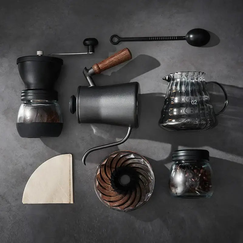 Black ceramic pour-over coffee maker with glass carafe and wooden handle in the decorbites glass coffee brewer set