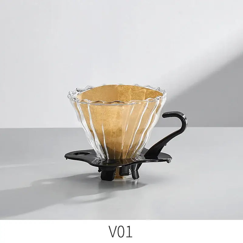 Handcrafted decorbites glass coffee brewer with clear scalloped glass dripper and black metal handle and base for pour over