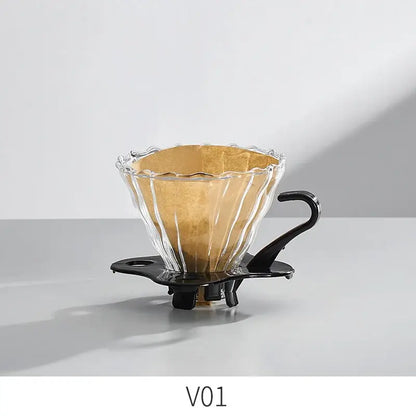 Handcrafted decorbites glass coffee brewer with clear scalloped glass dripper and black metal handle and base for pour over