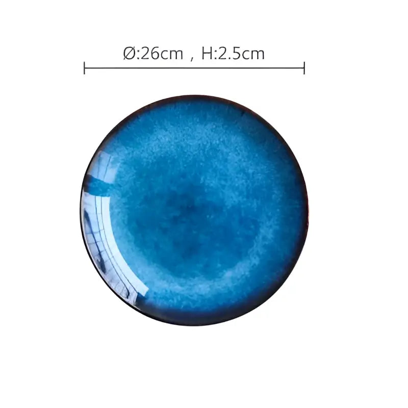 Handcrafted ceramic round plate with gradient blue glaze and glossy finish in dining room set of 3