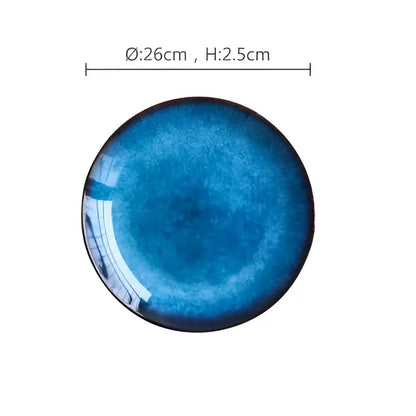 Handcrafted ceramic round plate with gradient blue glaze and glossy finish in dining room set of 3