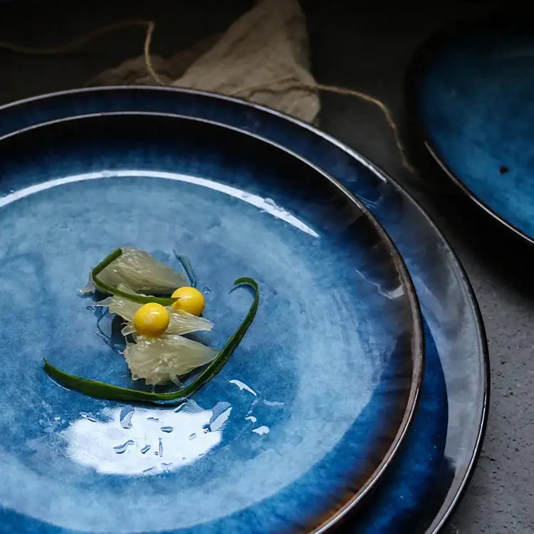 Deep blue handcrafted ceramic round plate with glossy gradient glaze and subtle texture for dining room set of 3